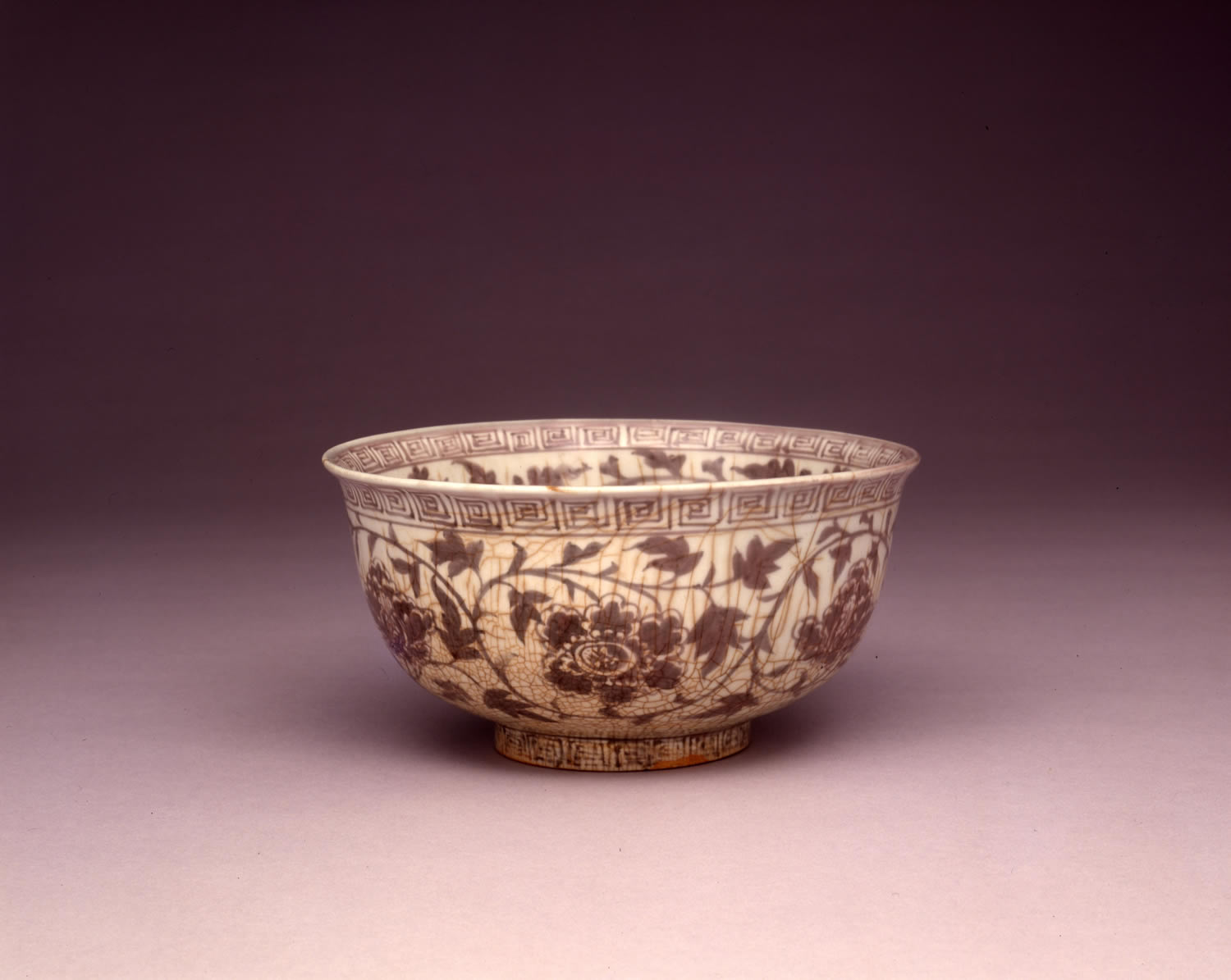 Bowl with flower scroll design in underglaze red