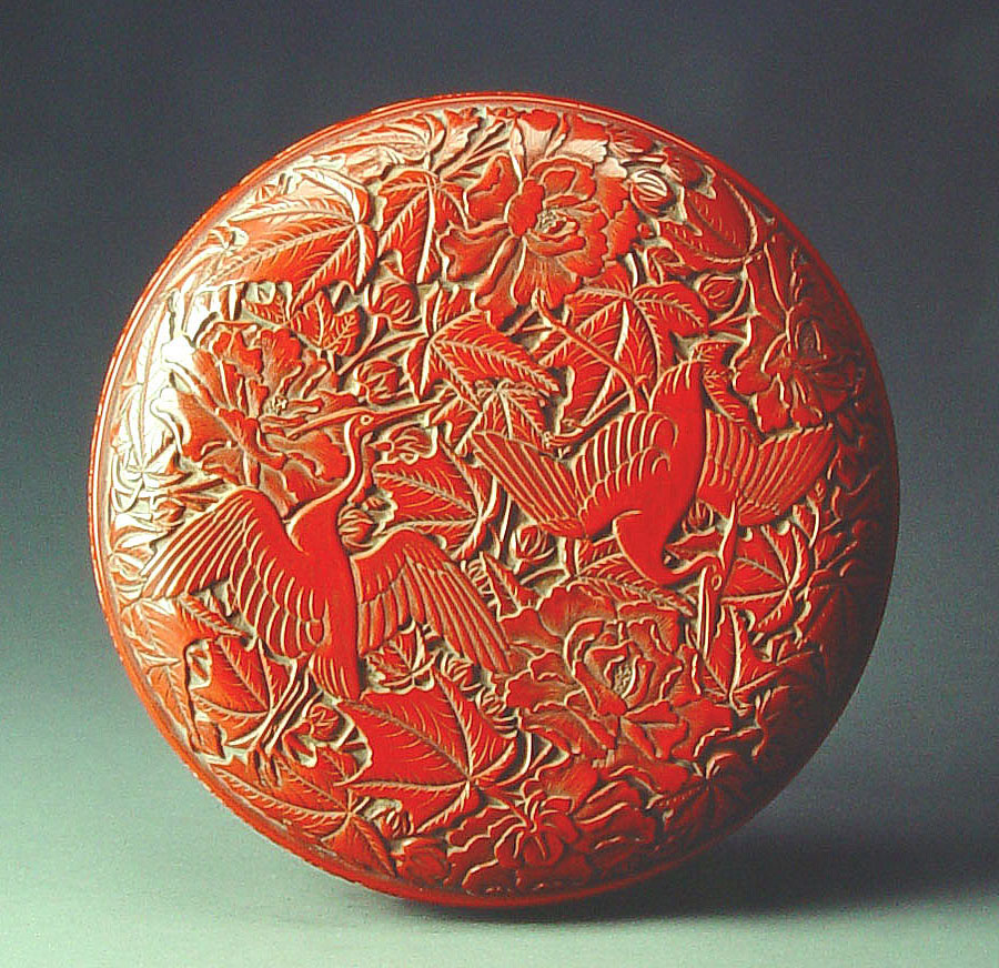 Carved red lacquer box with bird and flower design