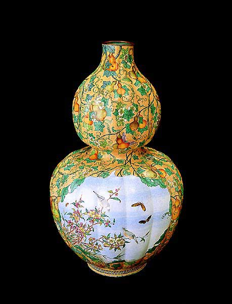 Painted enamel vase in double gourd shape with bird and flower design in reserved panels
