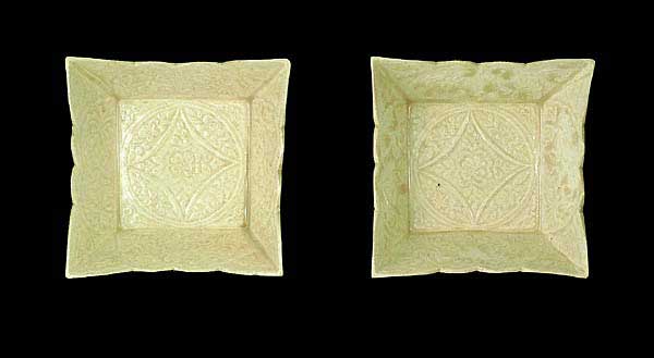 Pair of square plates with moulded floral design in white glaze