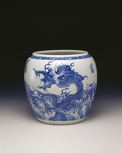 Jar with dragons amidst wave design in underglaze blue