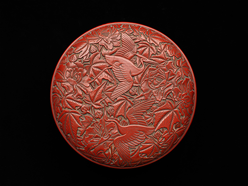 Carved red lacquer box with bird and flower design