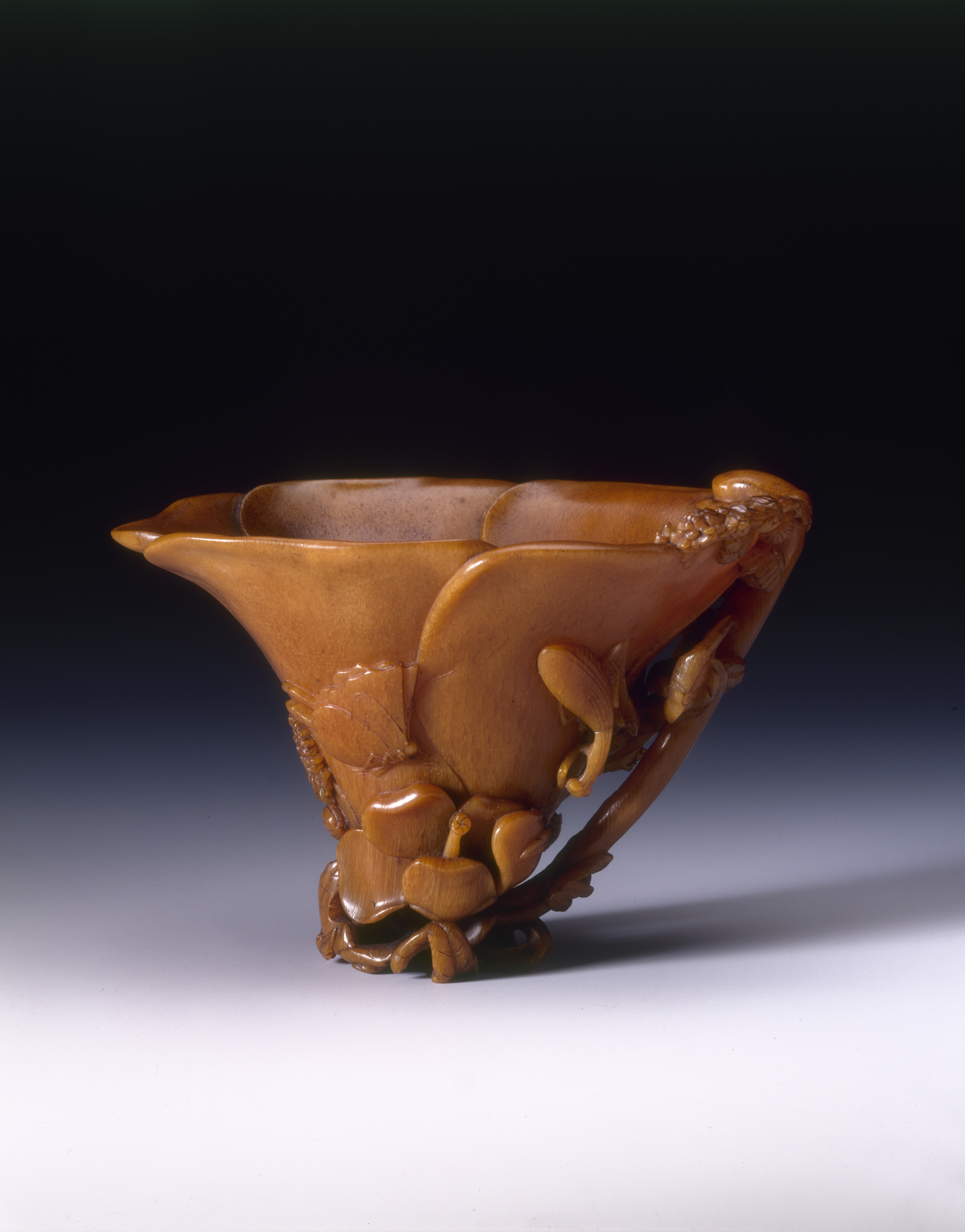 Rhinoceros horn cup carved with mantis and butterfly design