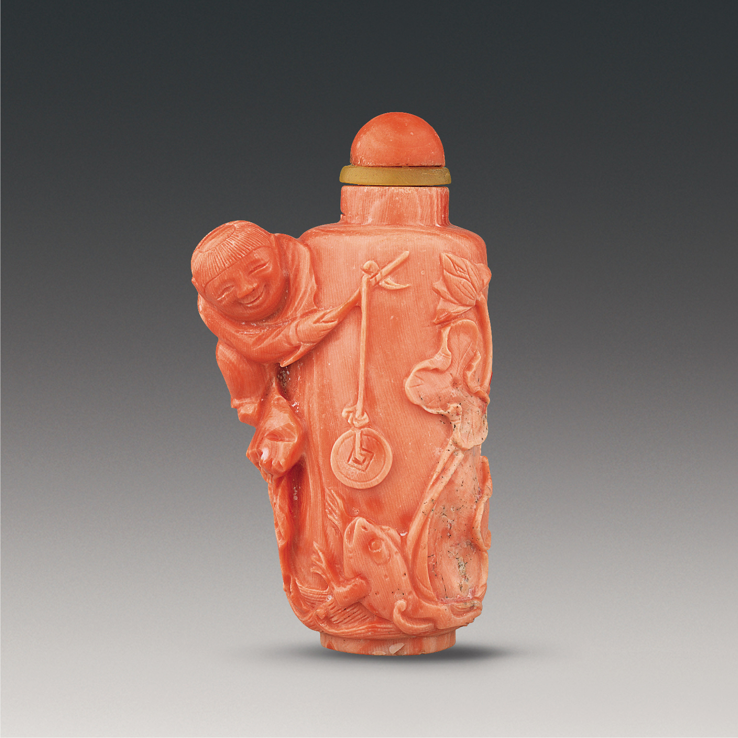 Coral snuff bottle with "Liu Hai playing with a toad" design carved in the round