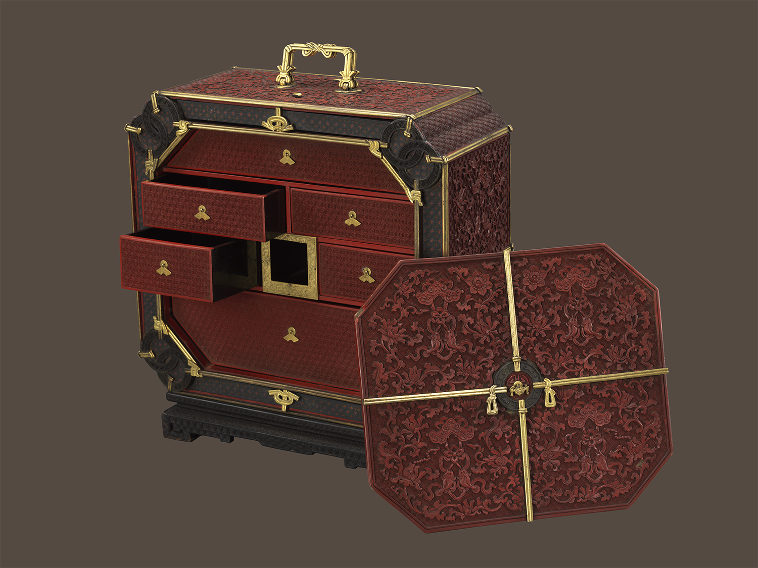 Carved red lacquer box with qing-chimes and fish design 