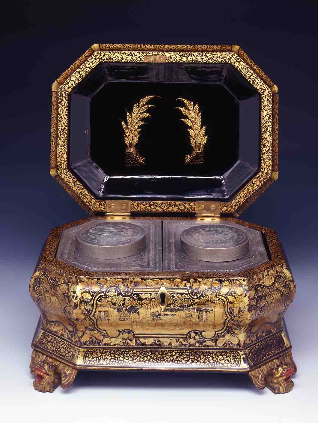 Black and gilt lacquer tea caddy with figures in garden scenes