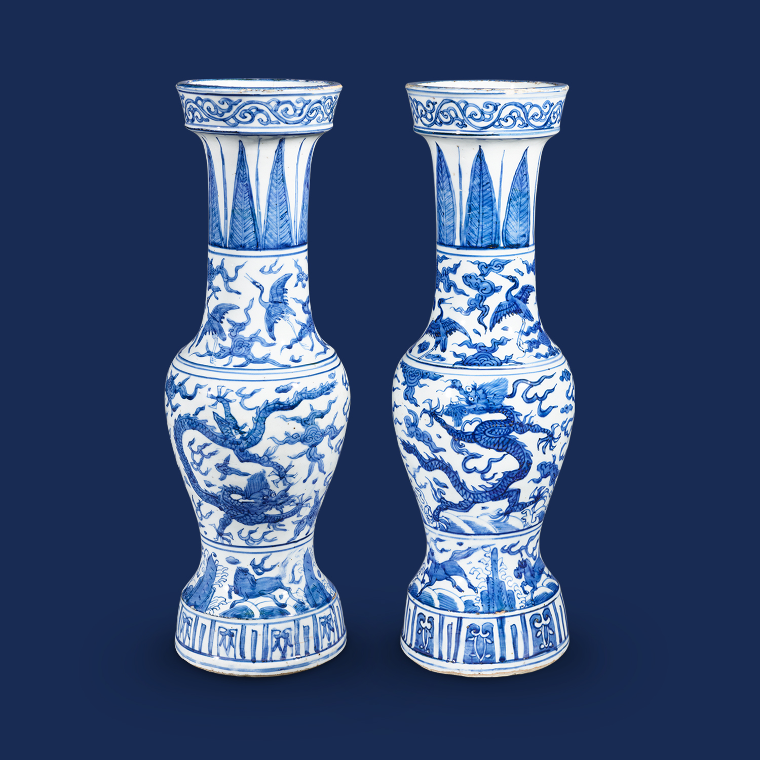 Pair of temple vases with dragons and flaming pearls amidst clouds design in underglaze blue