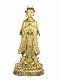 A standing gilt bronze figure of Longnü